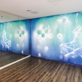 Find your perfect fit at Legendary Glendale a yoga studio with a mural on the wall