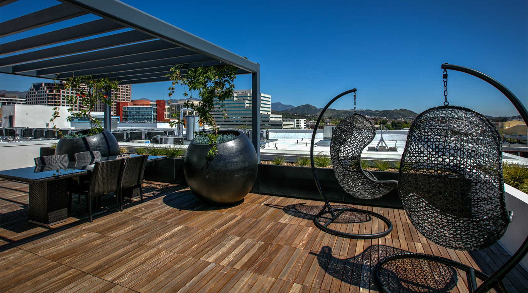 parallax image a patio with chairs overlooking a city