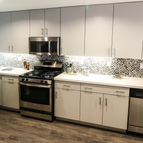 Spacious kitchens with thoughtful details a kitchen with white cabinets